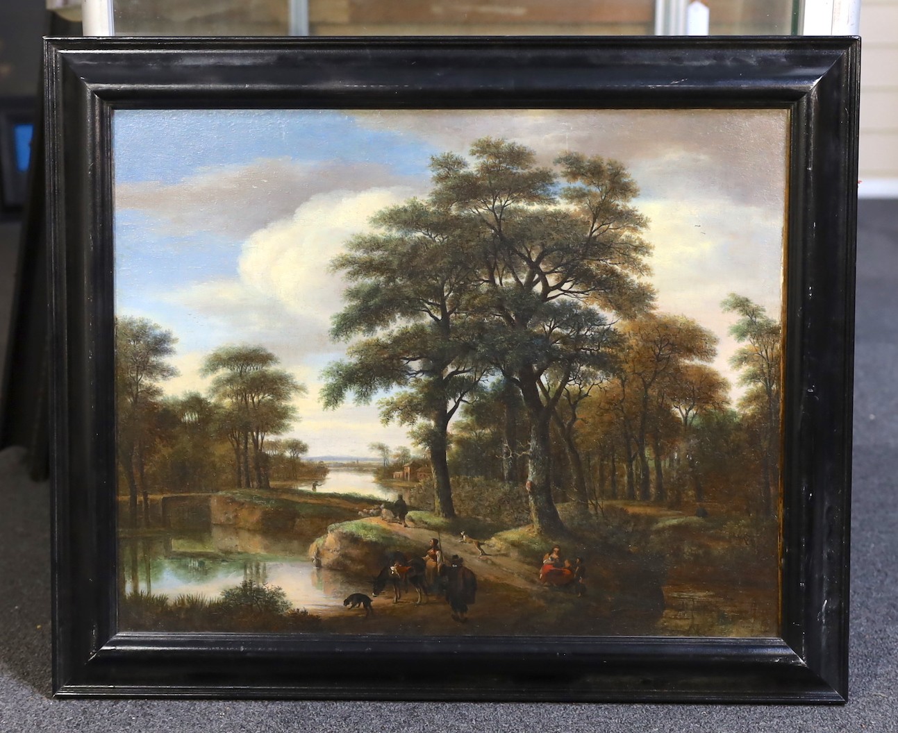 Pieter Jansz Van Asch (Dutch, 1603-1678), An extensive wooded river landscape with figures and animals, oil on canvas, 40 x 54cm